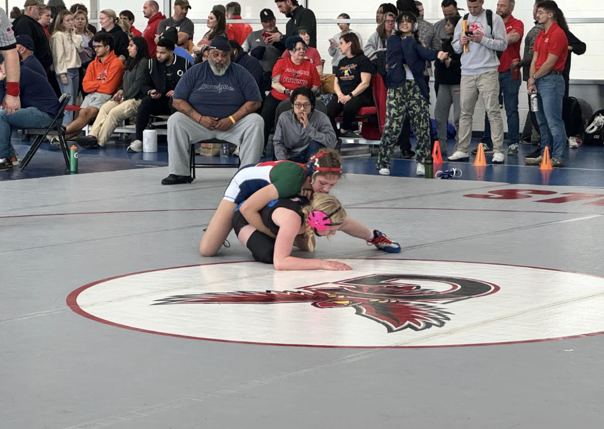 Two girl wrestlers are up against each other, with sophomore Jayelle Jones from Jefferson positioned atop her opponent. “It was a great experience. [It was] really difficult but I absolutely recommend it to girls especially. We can wrestle boys and we can fight. Don't let anyone tell you otherwise,” senior Harika Akundi said. 